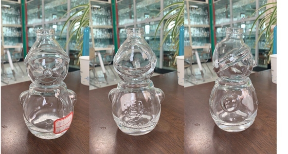 Bottiglia di whisky a forma di pupazzo di neve in vetro trasparente con manipolazione superficiale Decal
